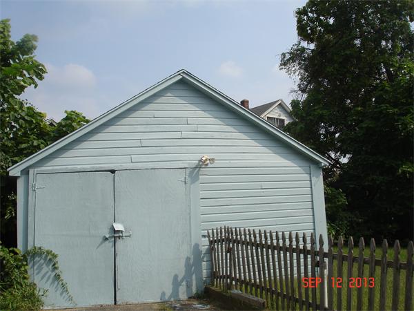 19 Rathbun Street Springfield, MA 01104 - Photo 5 of 5 a view of house that has a small yard next to a house
