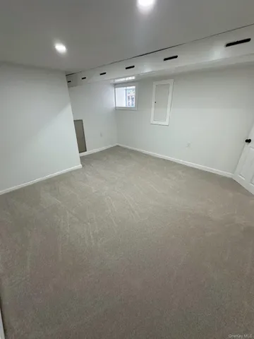 an empty room with a empty space and windows