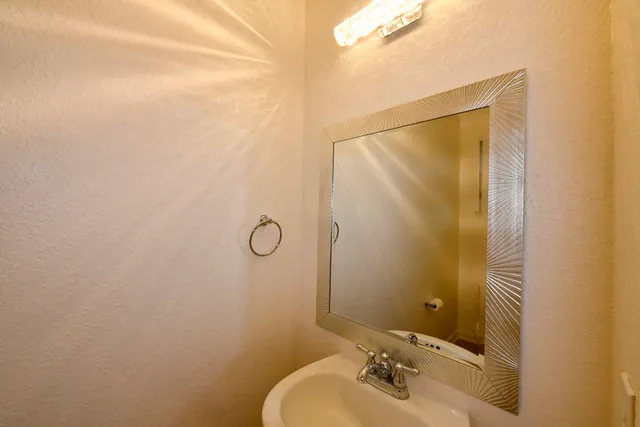 a bathroom with a sink and mirror