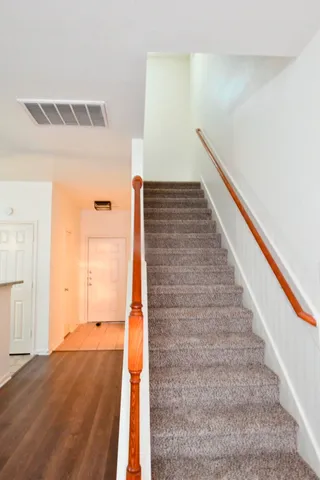 a view of a livingroom with a ceiling fan and window