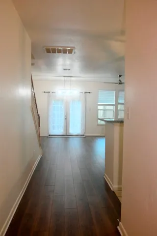 a view of gallery with wooden floor