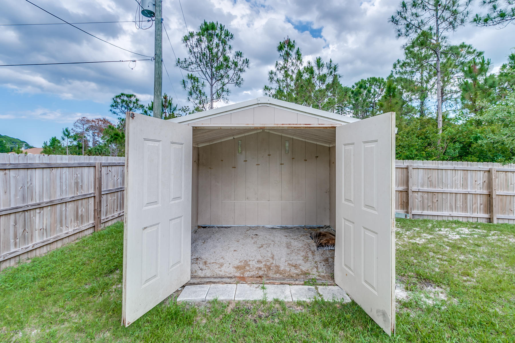 1304 Rabbit Street Southeast Palm Bay, FL 32909 - Photo 14 of 37 a view of a small yard