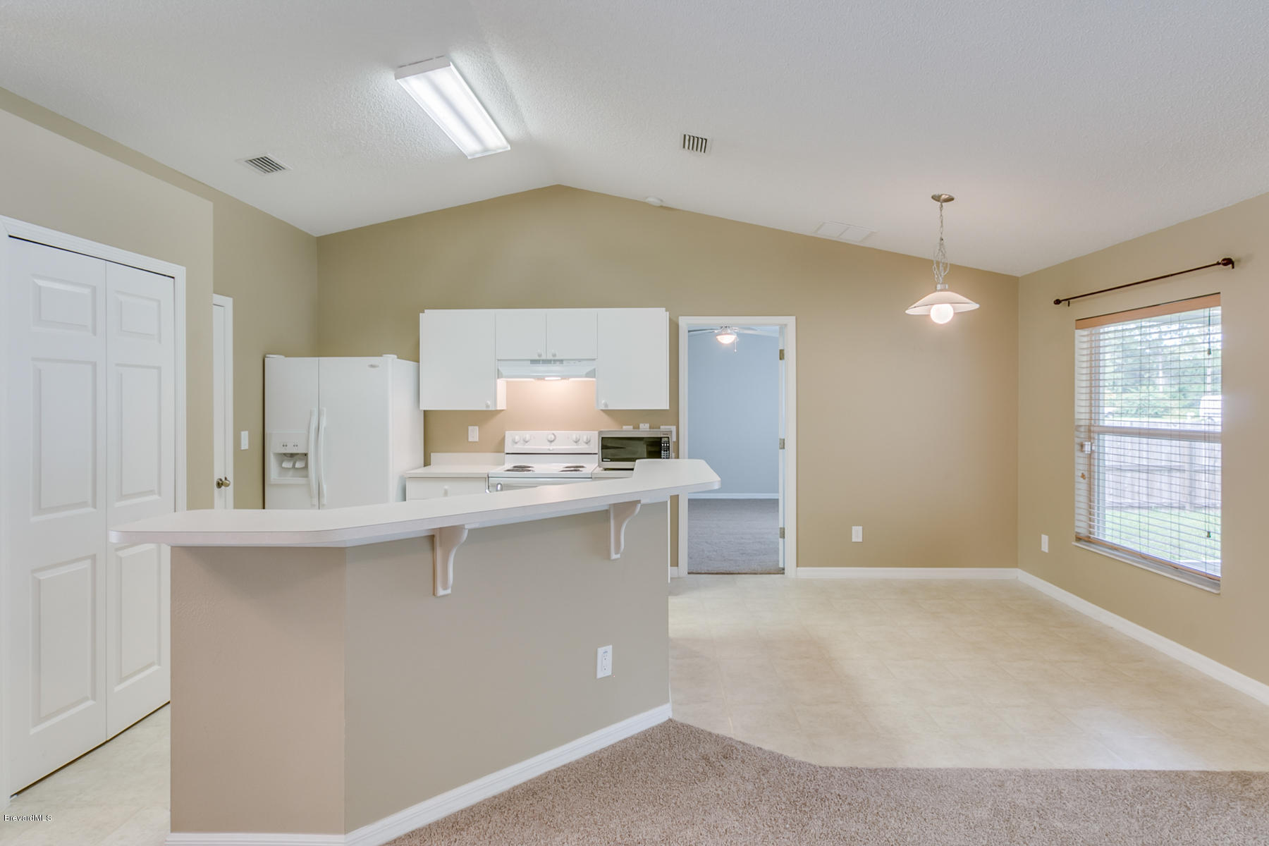 1304 Rabbit Street Southeast Palm Bay, FL 32909 - Photo 23 of 37 a spacious bathroom with a sink a mirror and a bathtub