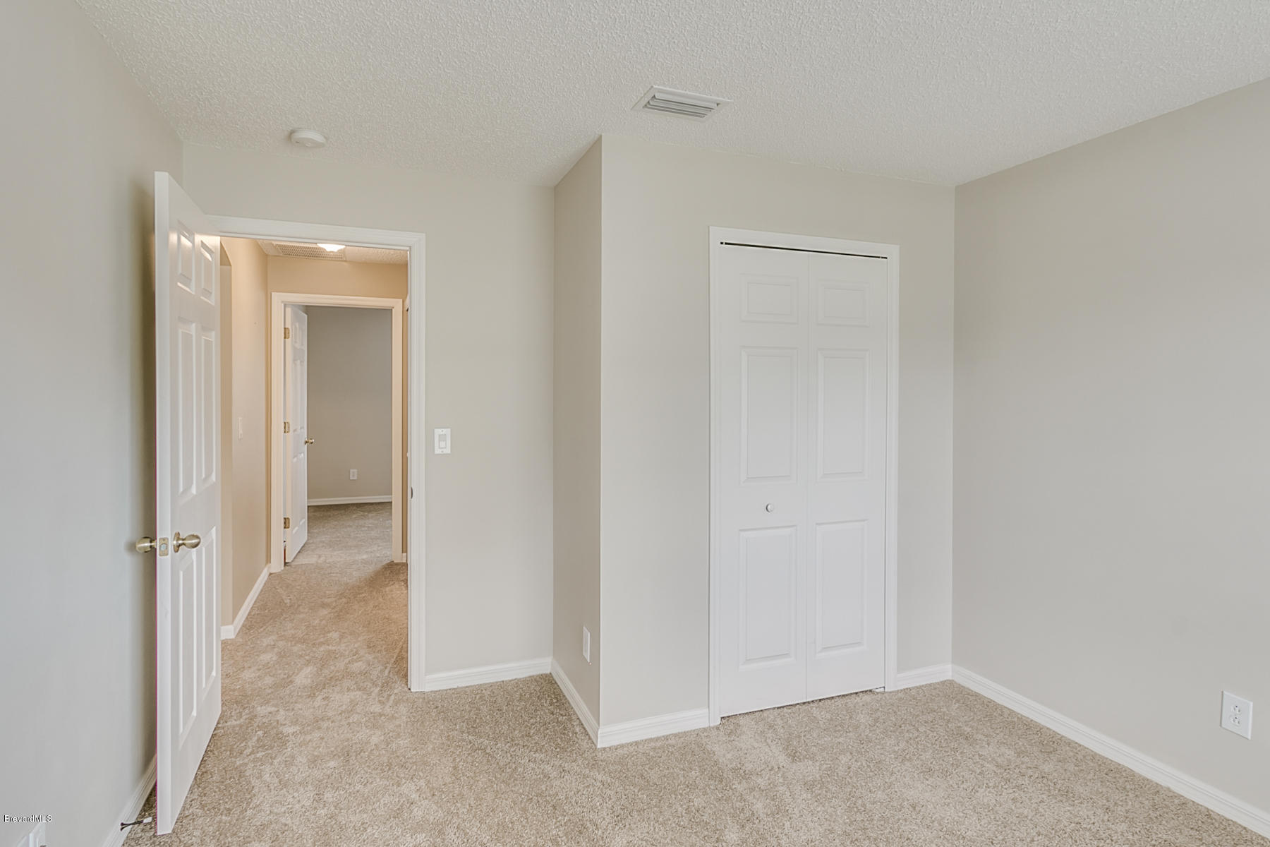 1304 Rabbit Street Southeast Palm Bay, FL 32909 - Photo 34 of 37 a view of an empty room with closet and a bathroom