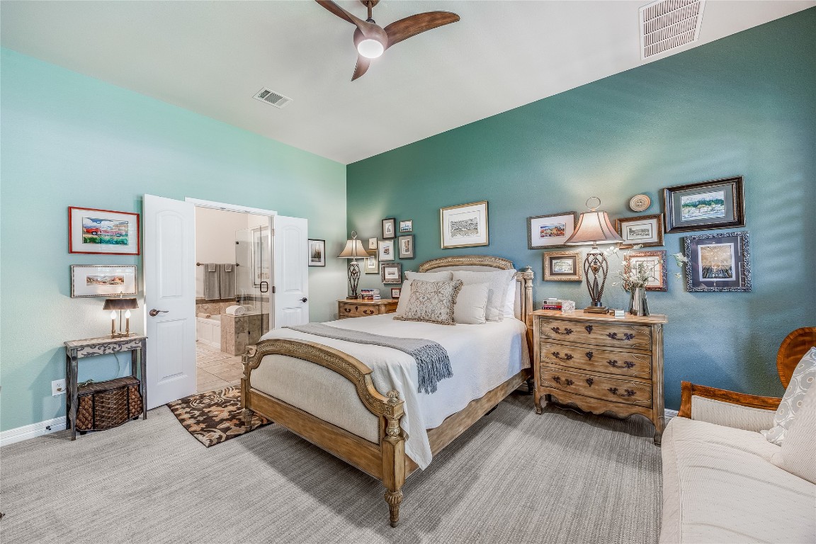 2930 Grand Oaks Loop, Unit 2901 Cedar Park, TX 78613 - Photo 18 of 33 a bedroom with a bed and a couch