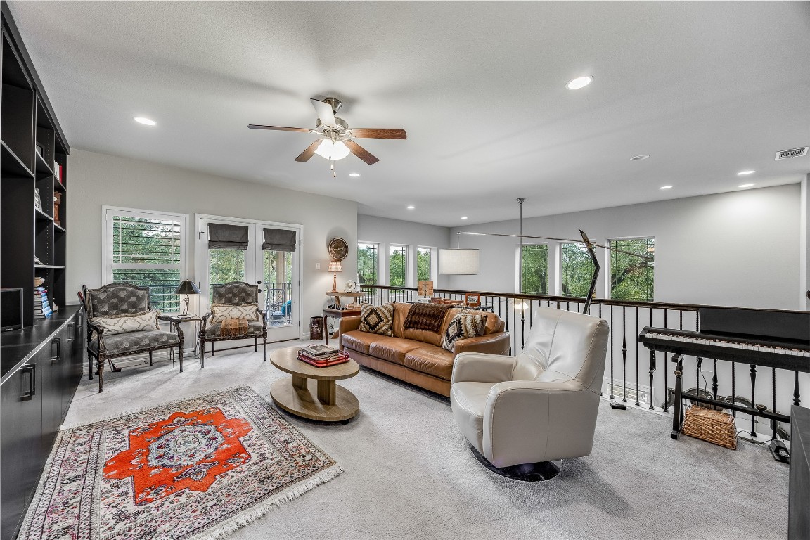 2930 Grand Oaks Loop, Unit 2901 Cedar Park, TX 78613 - Photo 19 of 33 a living room with furniture a rug and a large window