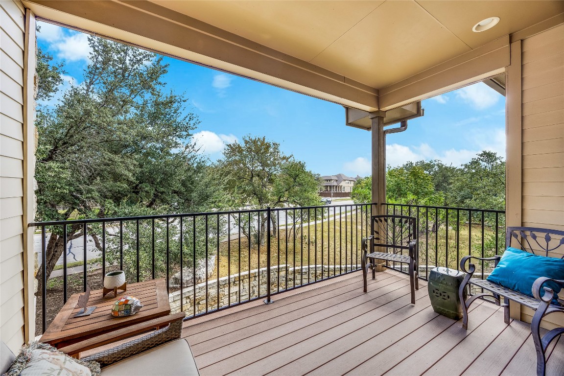 2930 Grand Oaks Loop, Unit 2901 Cedar Park, TX 78613 - Photo 26 of 33 a balcony with wooden floor and outdoor seating