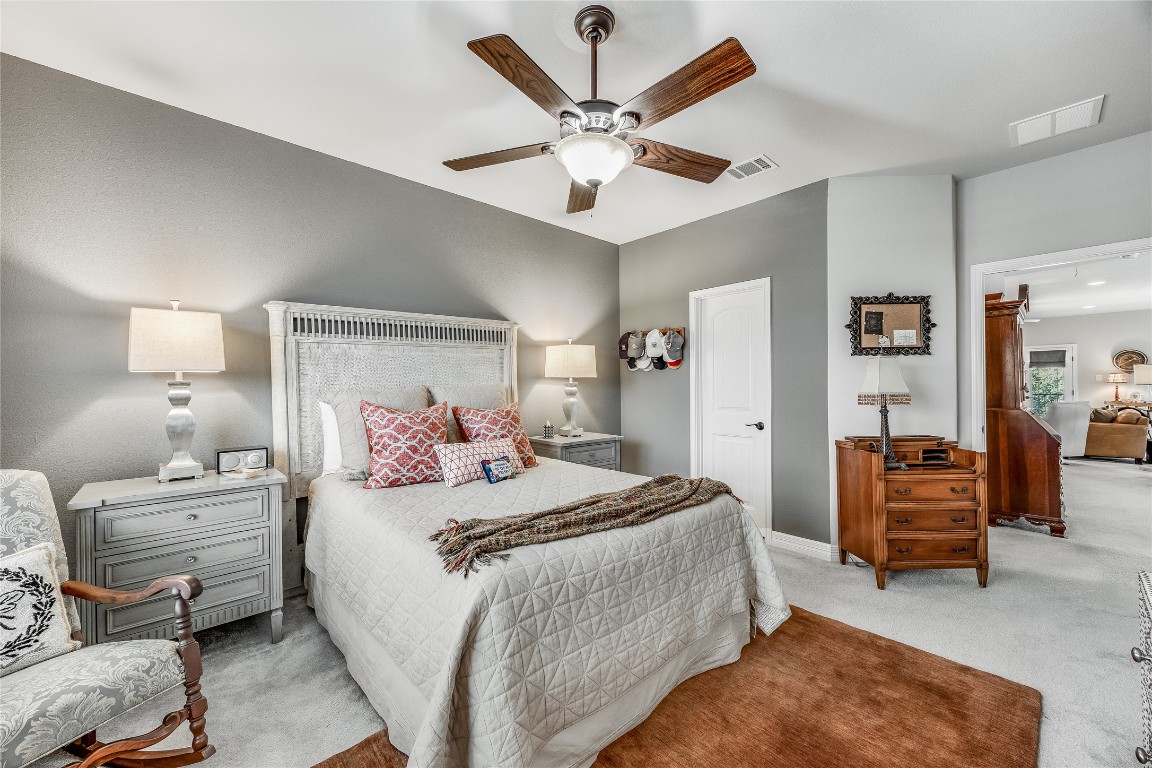 2930 Grand Oaks Loop, Unit 2901 Cedar Park, TX 78613 - Photo 28 of 33 a bedroom with a bed and ceiling fan