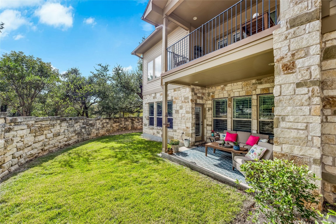 2930 Grand Oaks Loop, Unit 2901 Cedar Park, TX 78613 - Photo 32 of 33 a view of a house with backyard and sitting area