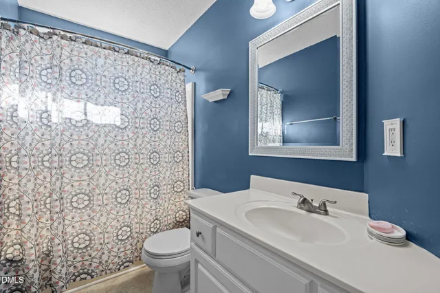 a kitchen with stainless steel appliances granite countertop a refrigerator sink and microwave