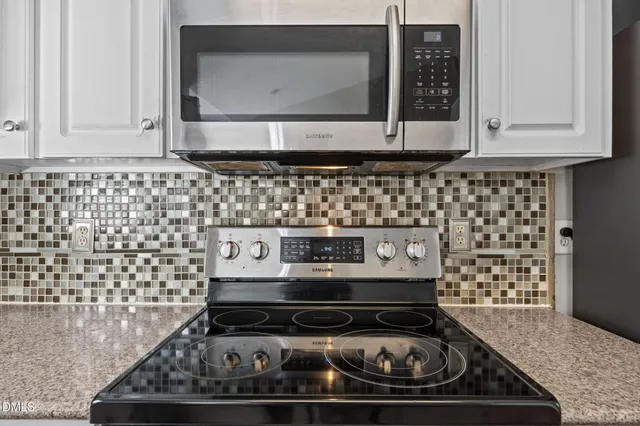 a view of a yard with large trees