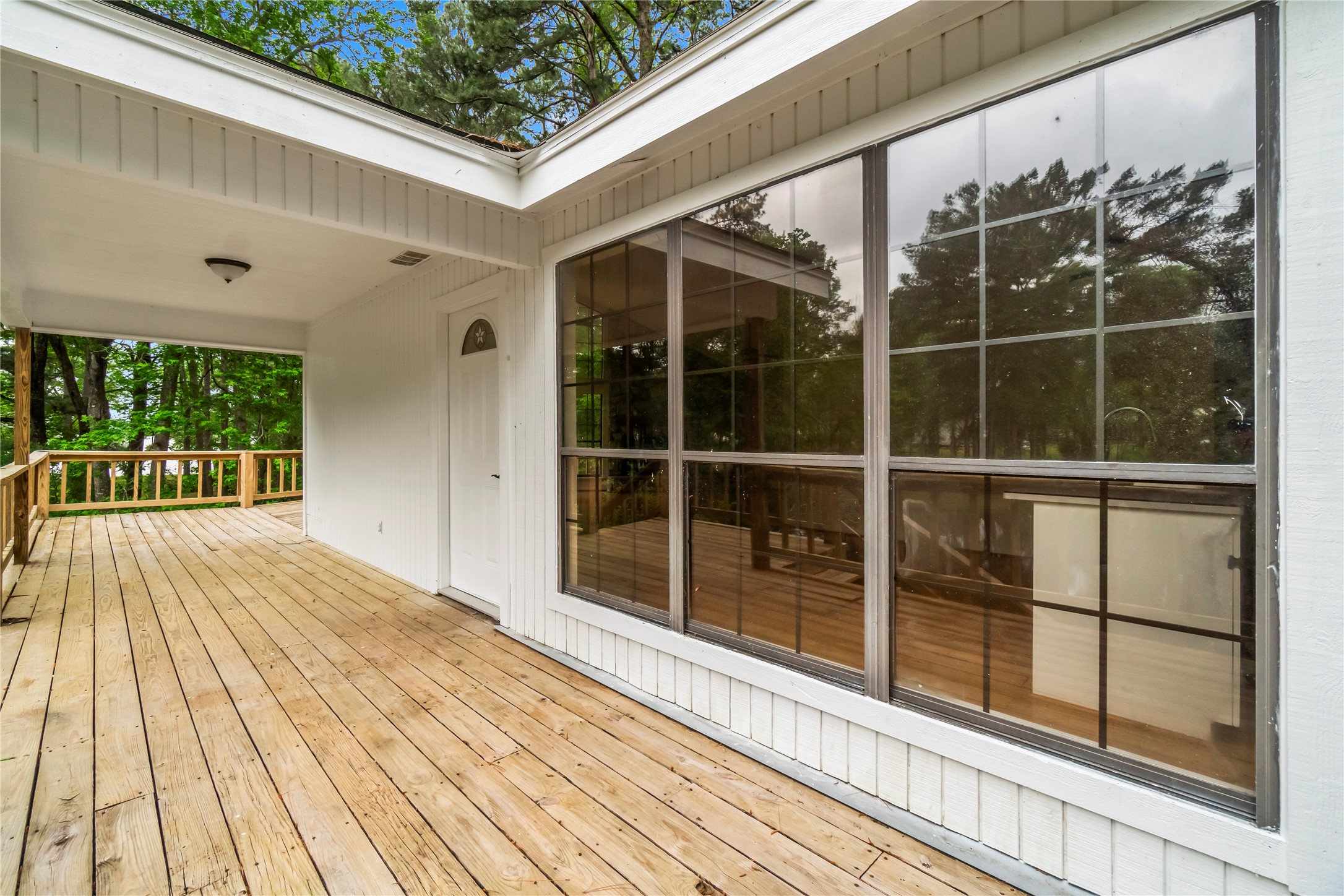 200 Johnson Road Coldspring, TX 77331 - Photo 14 of 49 a view of a balcony with wooden floor