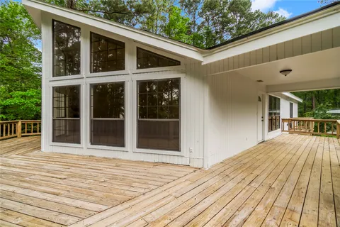 a view of balcony with wooden floor