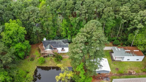an aerial view of a house with a garden
