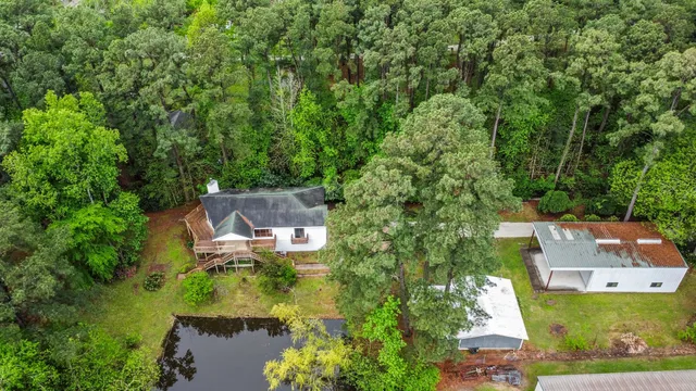 an aerial view of a house with a garden