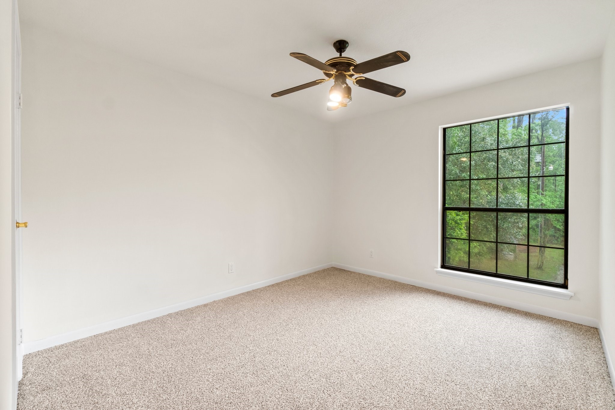 200 Johnson Road Coldspring, TX 77331 - Photo 36 of 49 an empty room with windows and fan