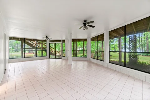 a view of an empty room with windows