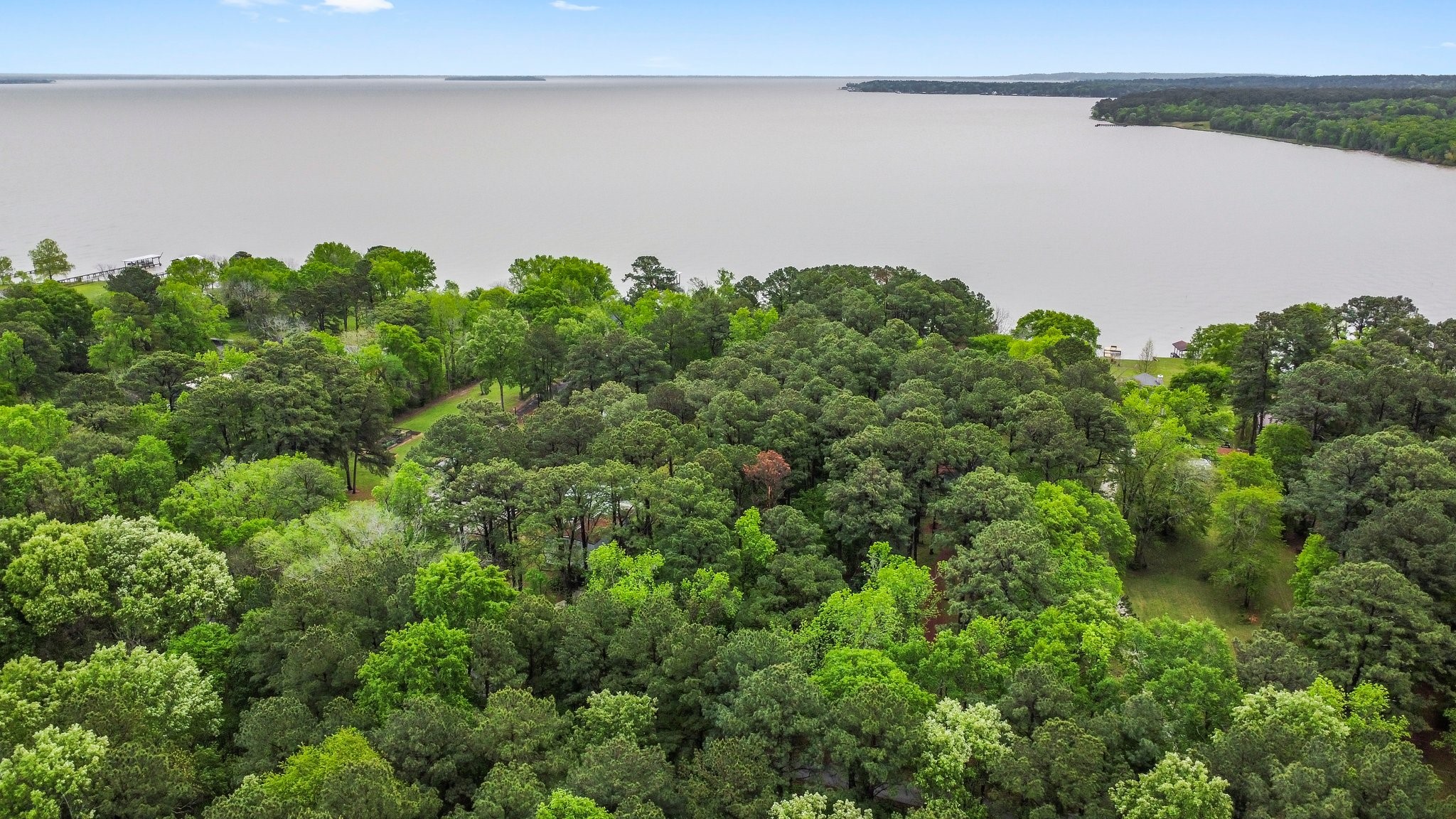 200 Johnson Road Coldspring, TX 77331 - Photo 48 of 49 a view of a lake and green space