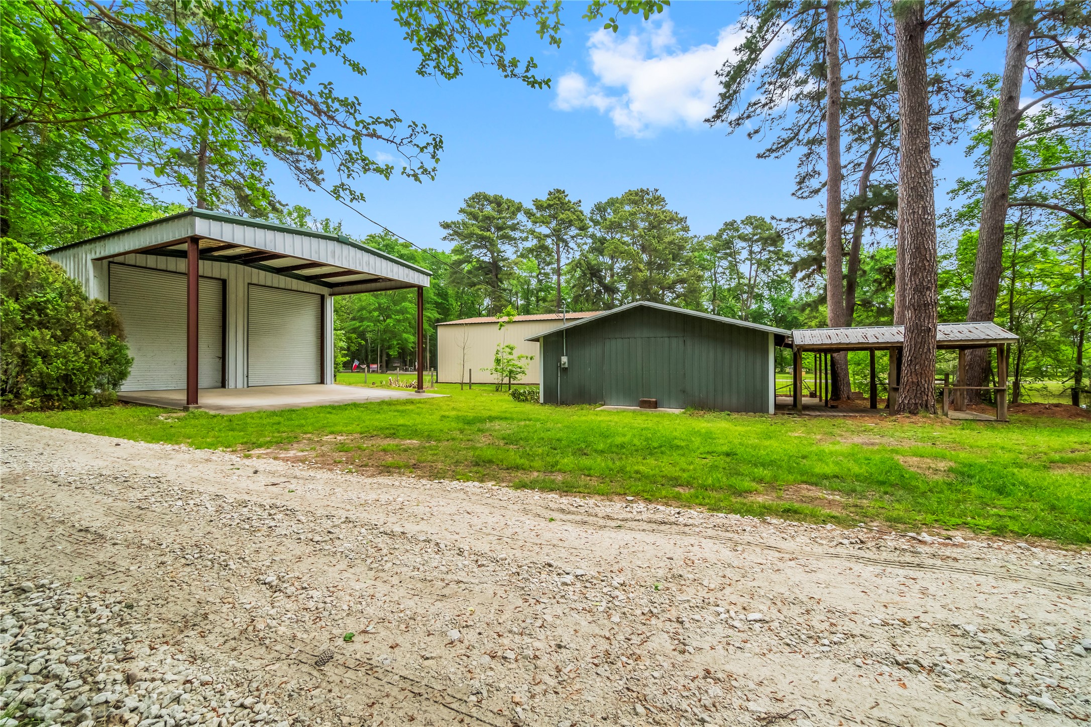 200 Johnson Road Coldspring, TX 77331 - Photo 6 of 49 a front view of a house with a yard and trees