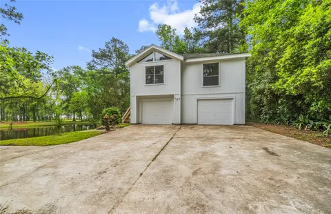 a view of lake with a yard