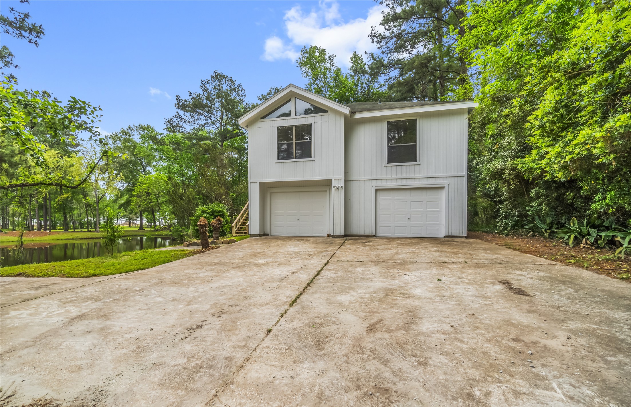 200 Johnson Road Coldspring, TX 77331 - Photo 7 of 49 a view of garage and yard