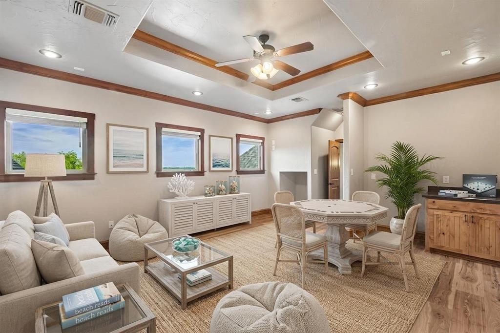 2085 Switzer Road Sanger, TX 76266 - Photo 21 of 39 Virtually Staged - Spacious bonus room featuring wood-finish flooring, a tray ceiling with a ceiling fan, recessed lighting, and multiple windows