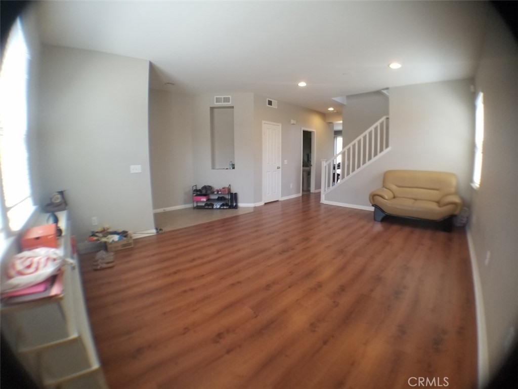 1688 Julia Way Riverside, CA 92501 - Photo 18 of 36 a room with furniture and wooden floor