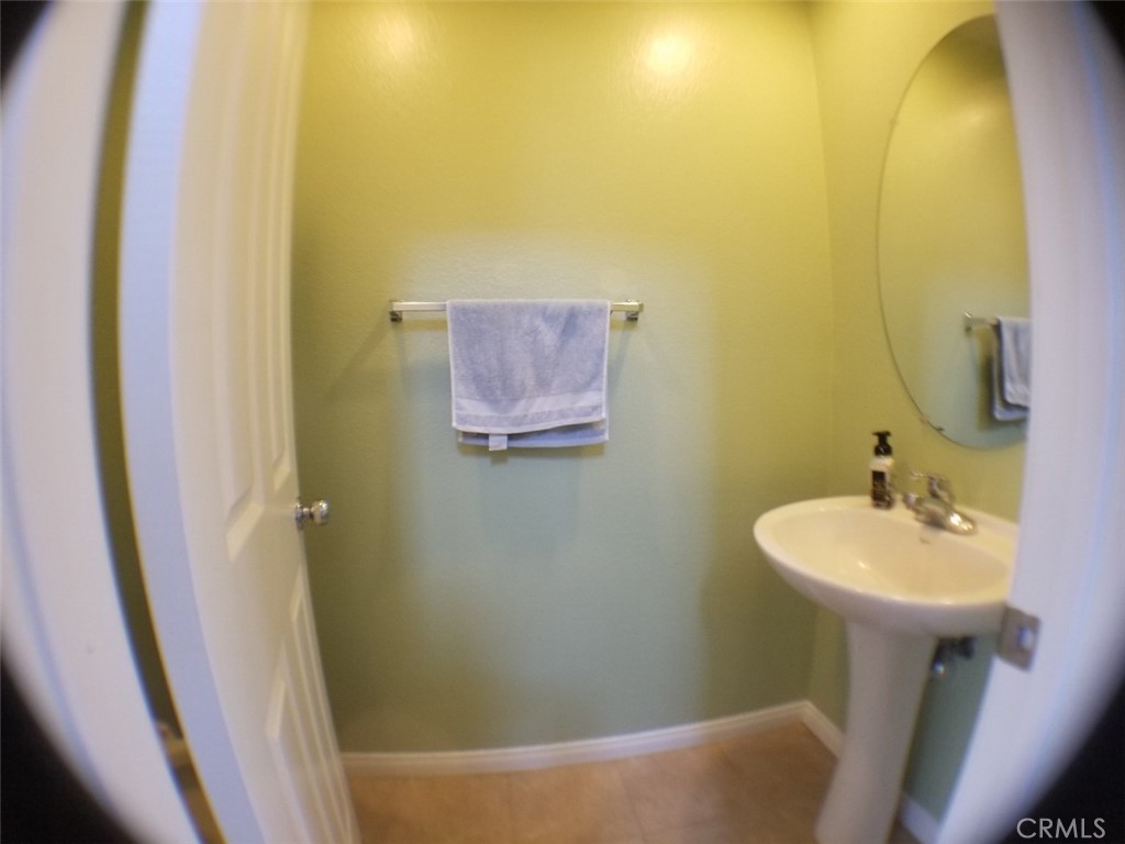 1688 Julia Way Riverside, CA 92501 - Photo 19 of 36 a bathroom with a sink and a mirror