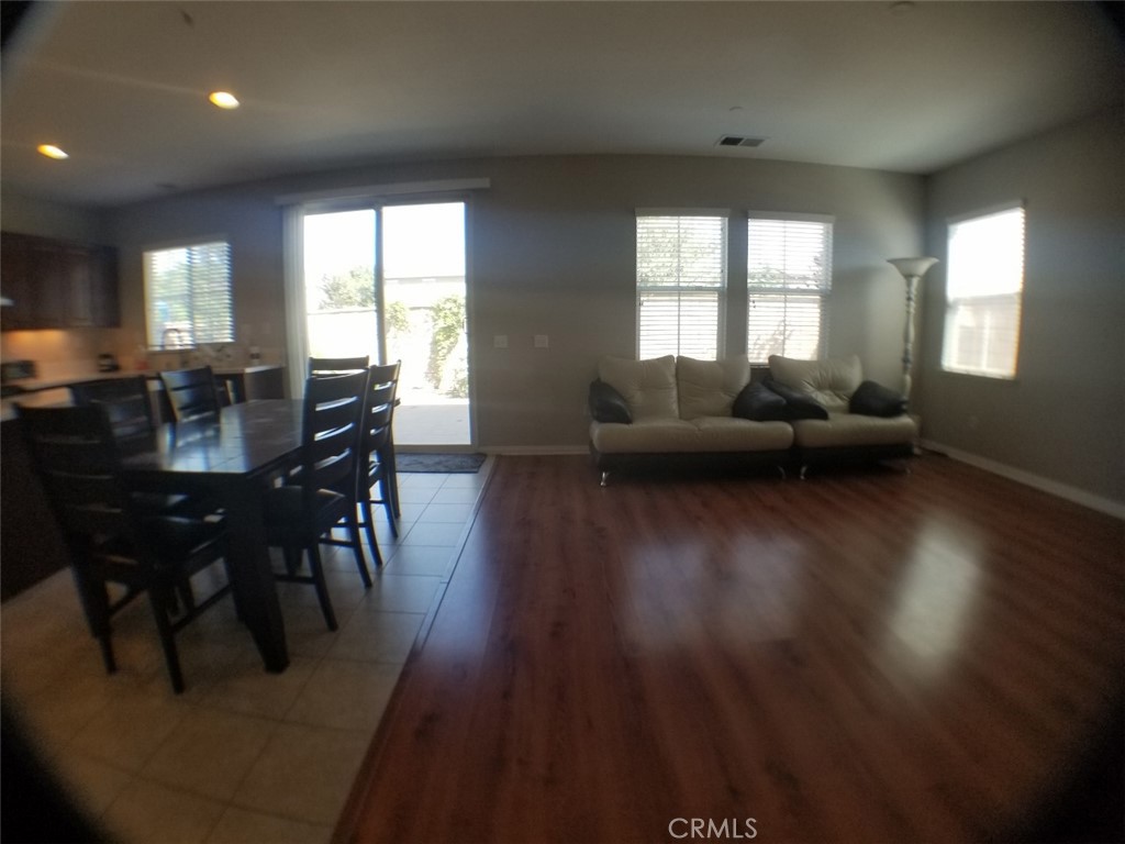 1688 Julia Way Riverside, CA 92501 - Photo 21 of 36 a view of a dining room with furniture and wooden floor
