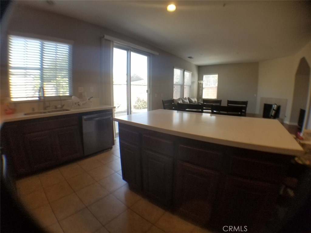 1688 Julia Way Riverside, CA 92501 - Photo 24 of 36 a kitchen with a sink cabinets and window