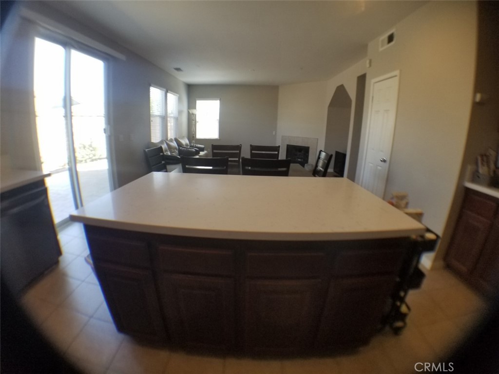 1688 Julia Way Riverside, CA 92501 - Photo 25 of 36 a large kitchen with a table and chairs
