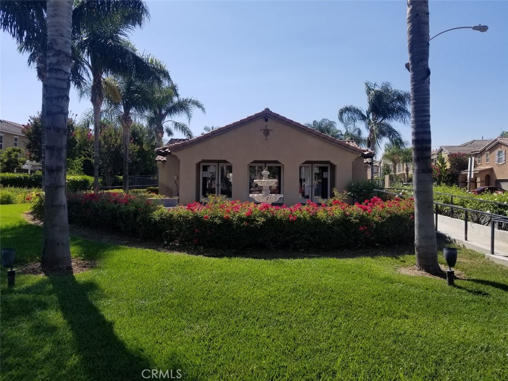 1688 Julia Way Riverside, CA 92501 - Photo 32 of 36 a front view of a house with a garden and yard