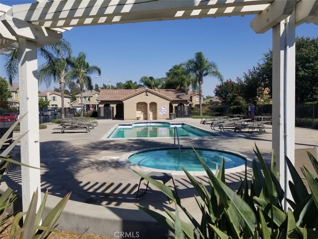 1688 Julia Way Riverside, CA 92501 - Photo 35 of 36 a swimming pool with outdoor seating and yard