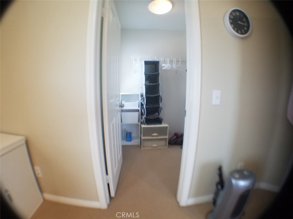 1688 Julia Way Riverside, CA 92501 - Photo 7 of 36 a view of a kitchen from a hallway
