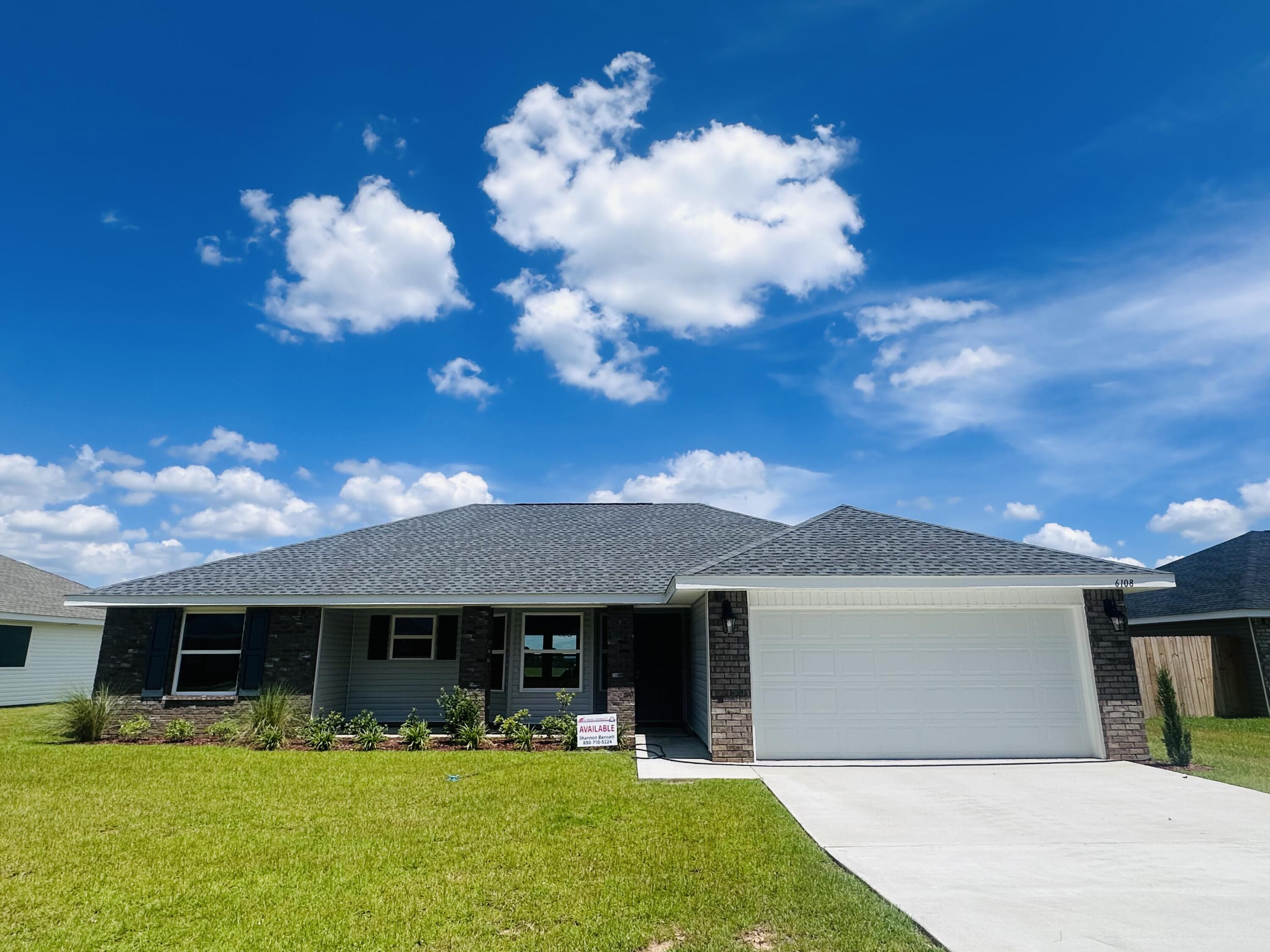 a front view of house with yard and seating area