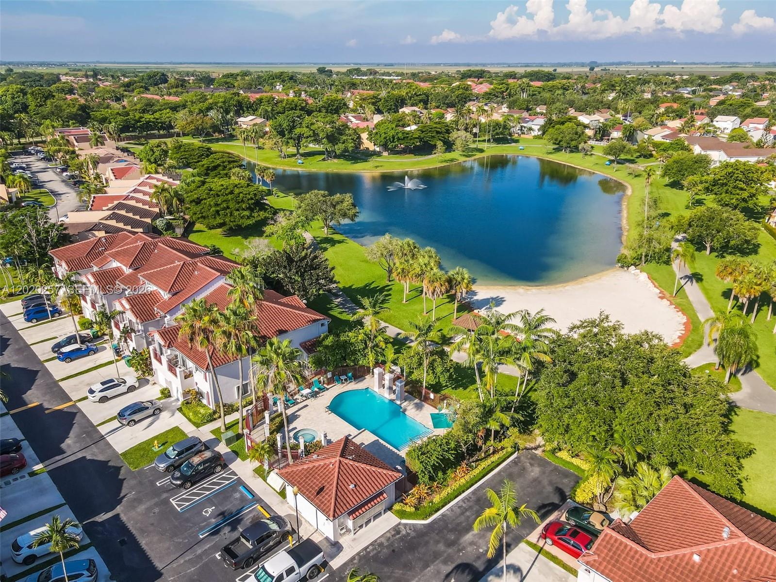 10245 Southwest 154th Place, Unit 1123 Miami, FL 33196 - Photo 35 of 38 an aerial view of residential houses with outdoor space