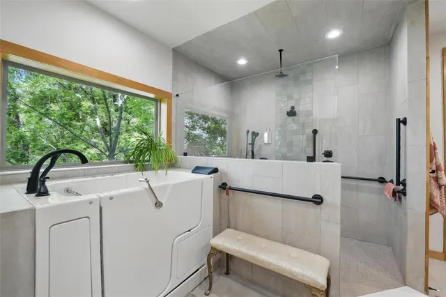 a white bath tub sitting next to a white sink