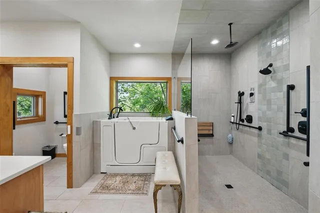 a large kitchen with a stove a sink dishwasher and a refrigerator