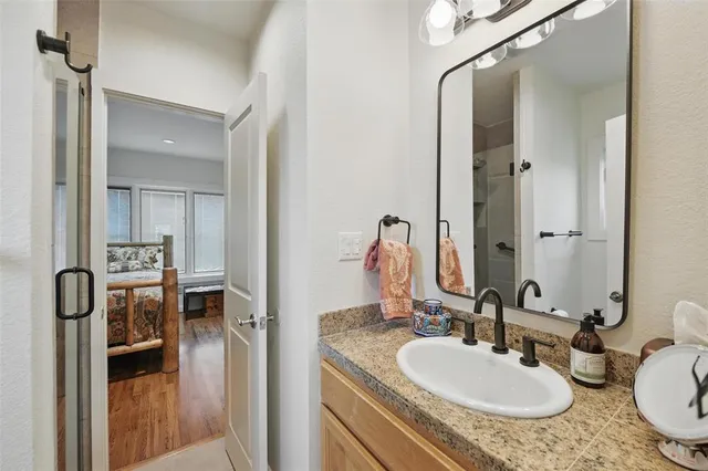 a view of balcony with wooden floor and fence