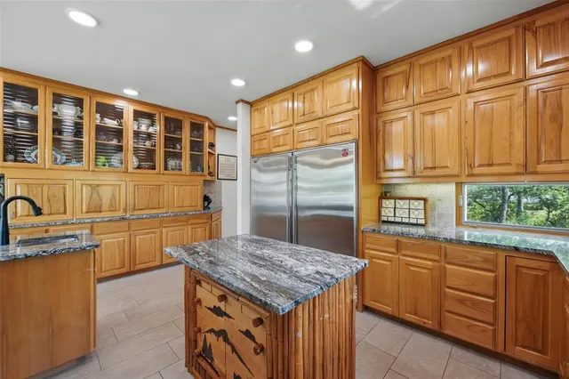 a kitchen with a stove a sink and a refrigerator