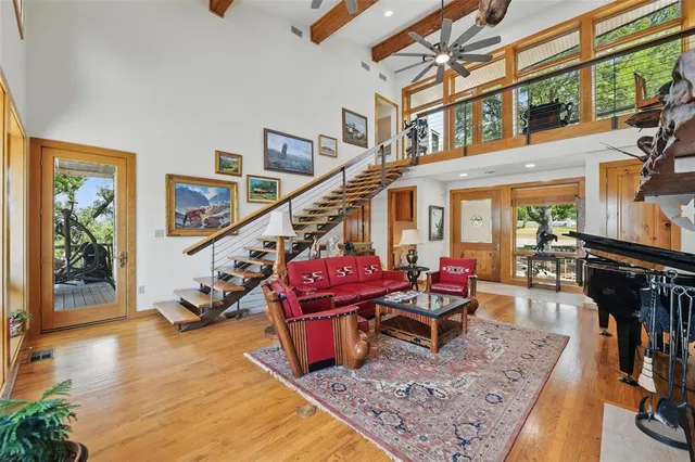 a living room with lots of furniture and a rug