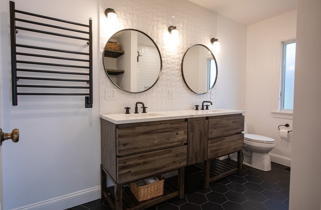 48 Amherst Road Belmont, MA 02478 - Photo 15 of 26 a bathroom with a toilet a sink and a mirror