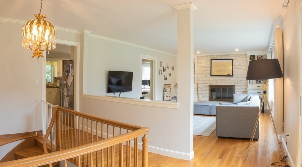 48 Amherst Road Belmont, MA 02478 - Photo 16 of 26 a view of a hallway with wooden floor and staircase