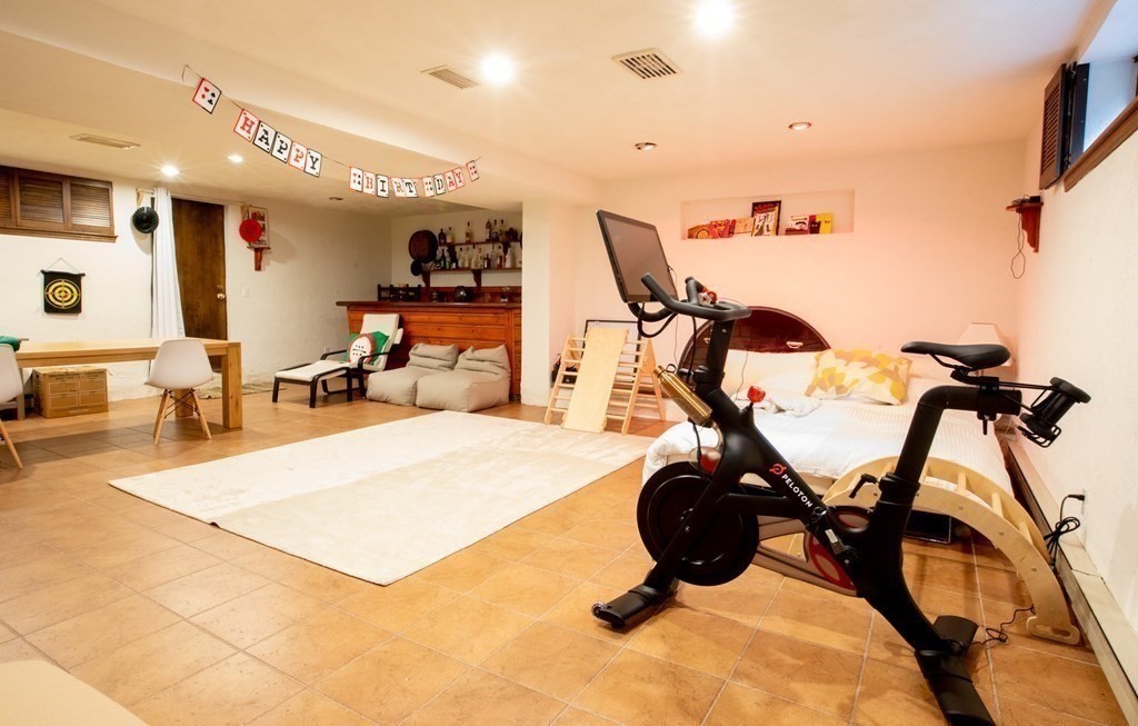 48 Amherst Road Belmont, MA 02478 - Photo 17 of 26 a room with gym equipment and a view of living room