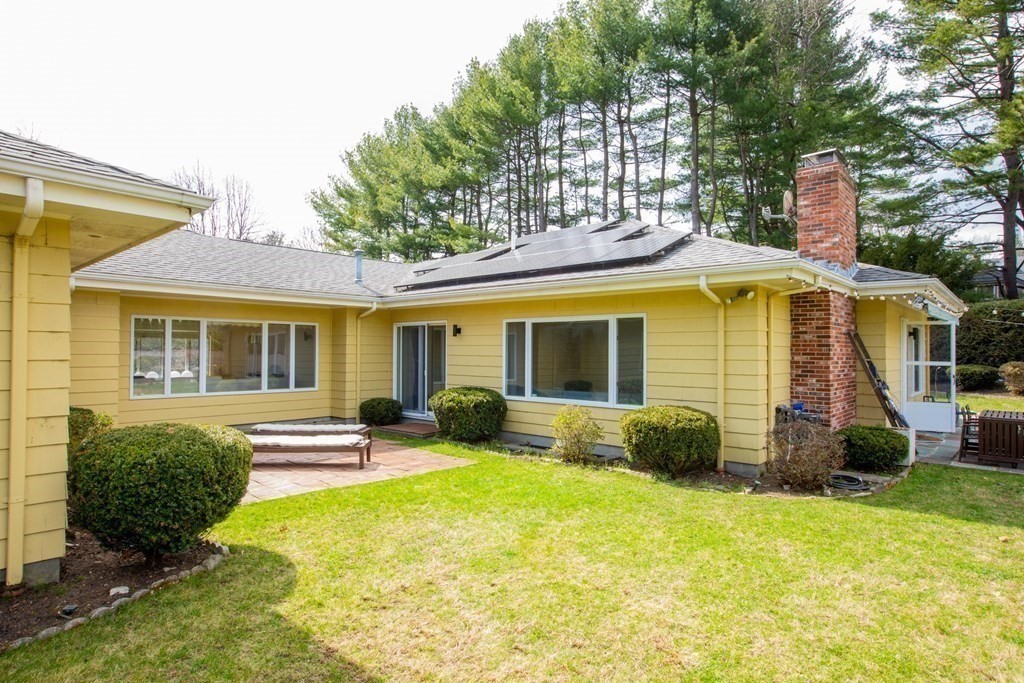 48 Amherst Road Belmont, MA 02478 - Photo 18 of 26 a view of a house with backyard sitting area and garden