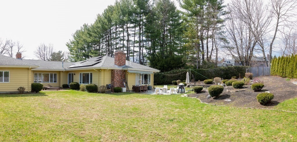 48 Amherst Road Belmont, MA 02478 - Photo 19 of 26 a view of a house with a yard and sitting area