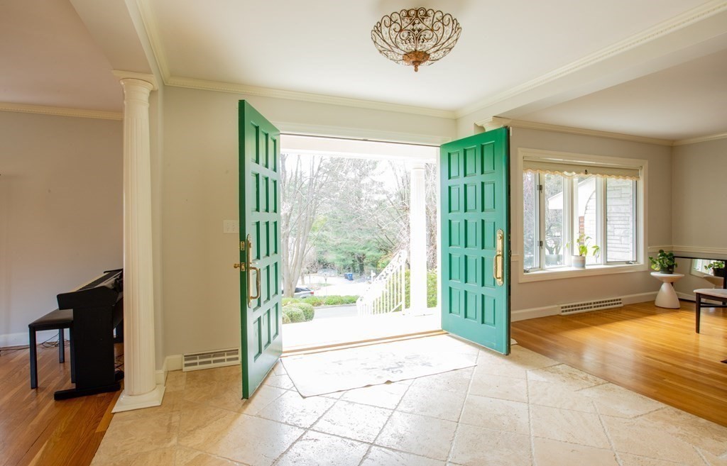 48 Amherst Road Belmont, MA 02478 - Photo 2 of 26 a living room with furniture and a floor to ceiling window