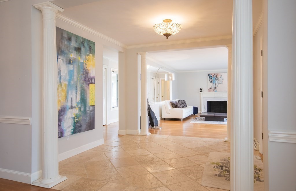 48 Amherst Road Belmont, MA 02478 - Photo 3 of 26 a view of a livingroom with furniture and a chandelier fan