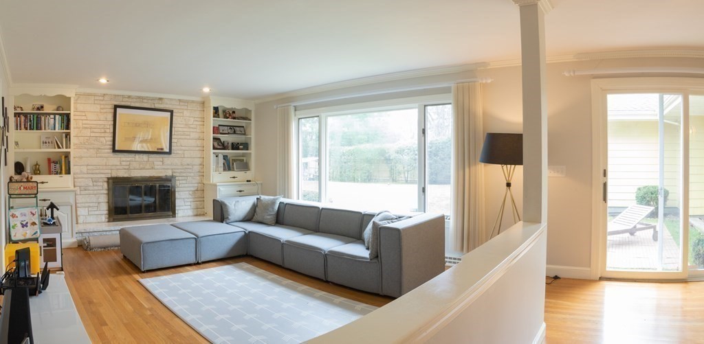 48 Amherst Road Belmont, MA 02478 - Photo 10 of 26 a living room with furniture and a fireplace