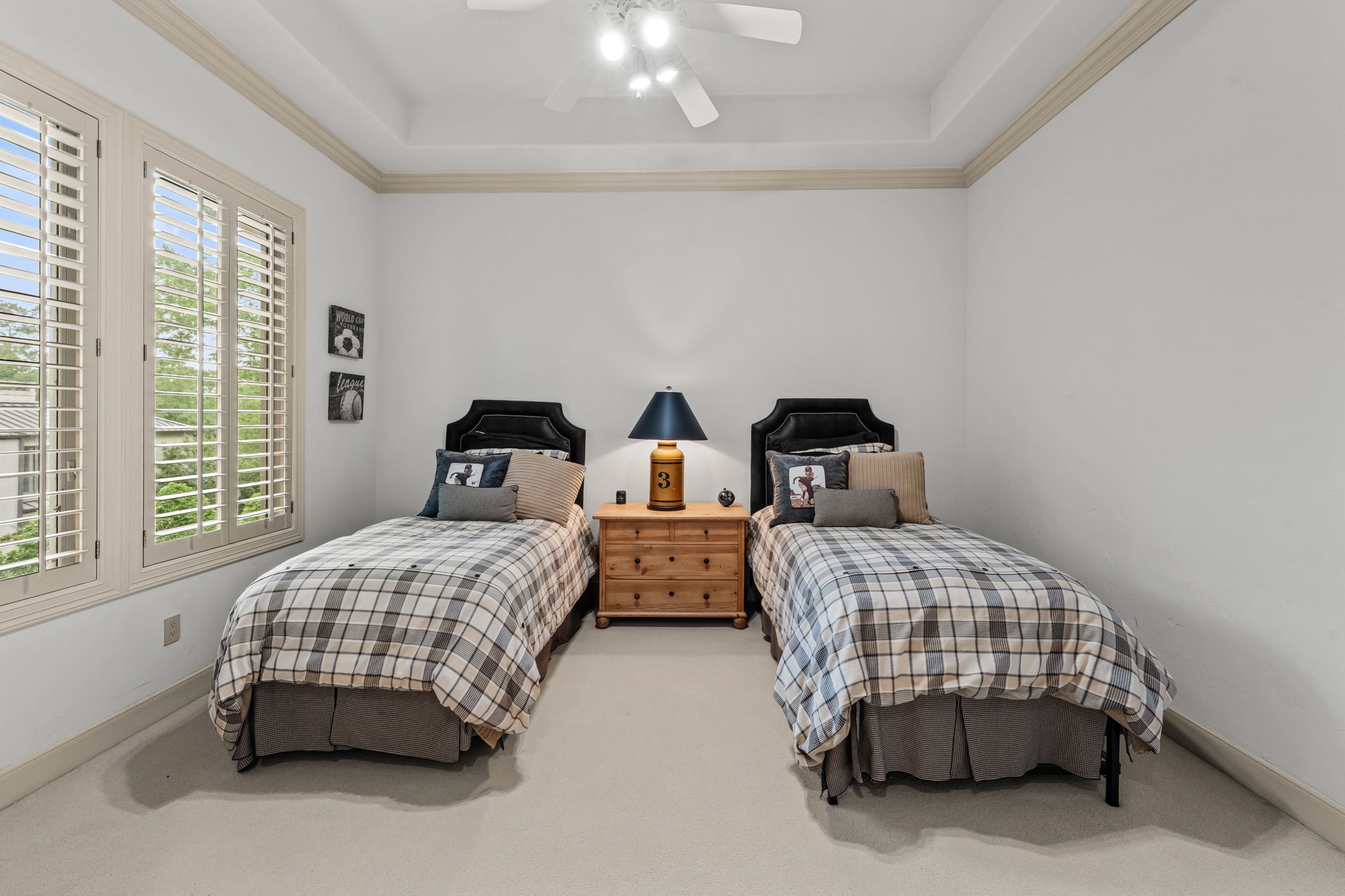 6 Mott Lane Houston, TX 77024 - Photo 40 of 50 Bright and inviting secondary bedroom featuring planation shutters, a trey ceiling, and generous space for multiple beds.